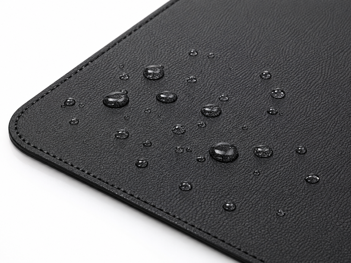 DeskHaus desk mat waterproof surface water droplets beading demonstration